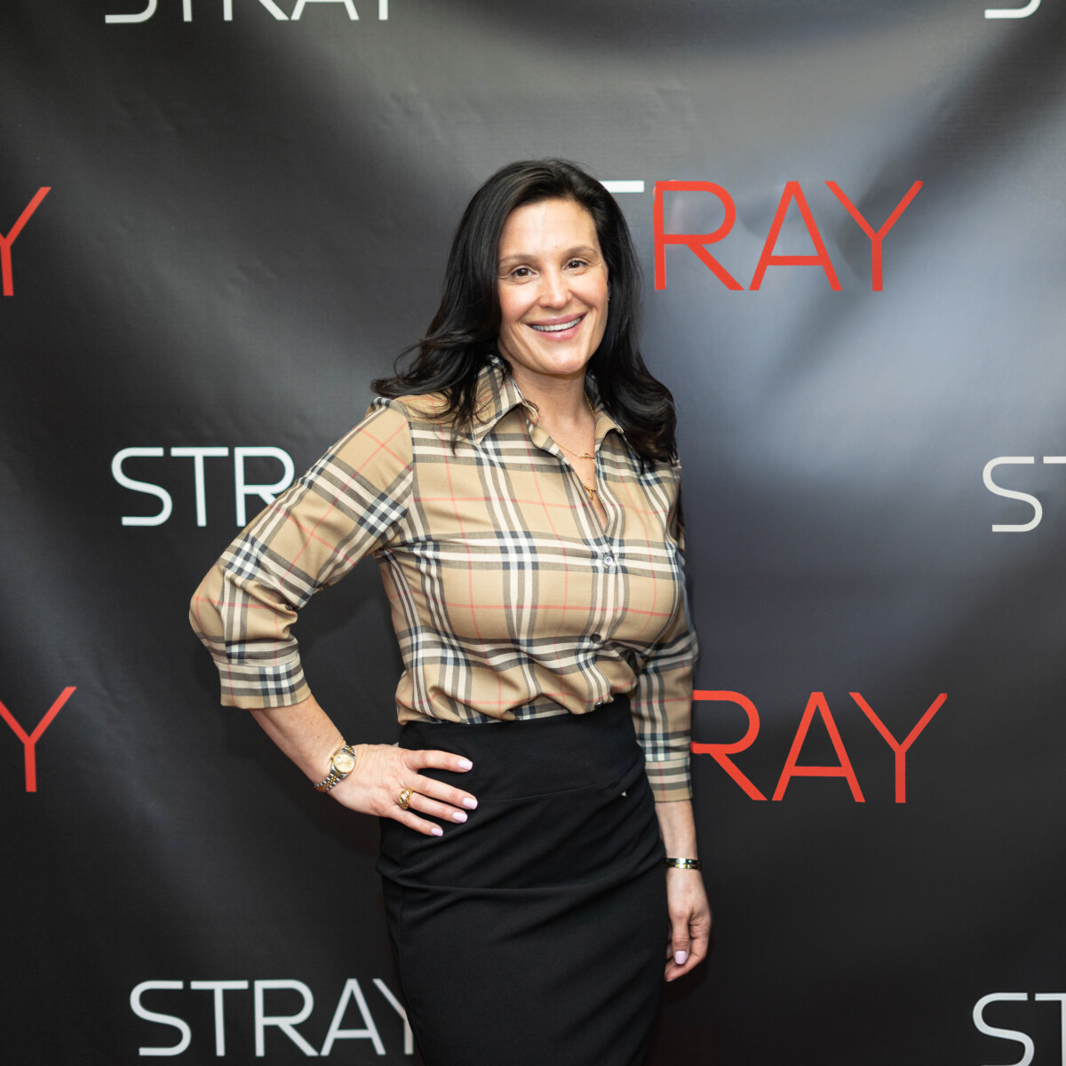 author Stacey caputi liakos posing at stray movie announcement event
